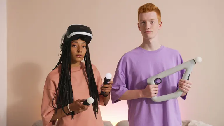 Two individuals using VR equipment for an immersive gaming experience indoors.