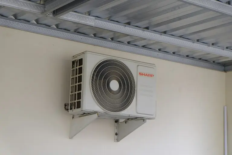 An air conditioning unit mounted on a wall.