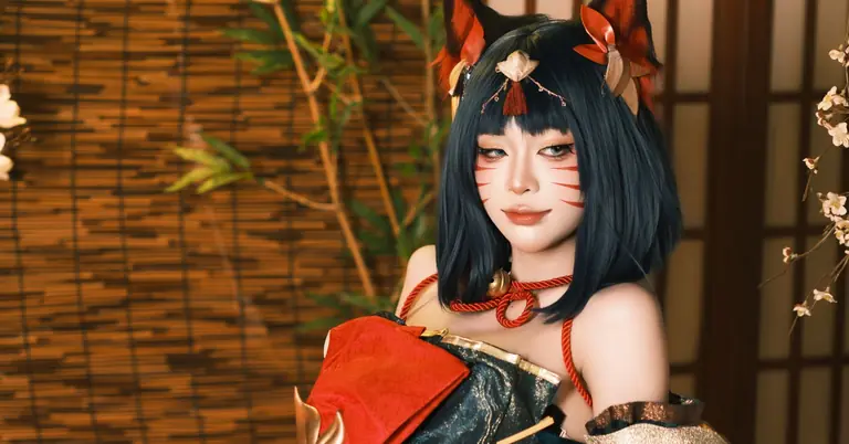Stunning portrait of a woman in traditional kimono, featuring fox ears and artistic makeup.